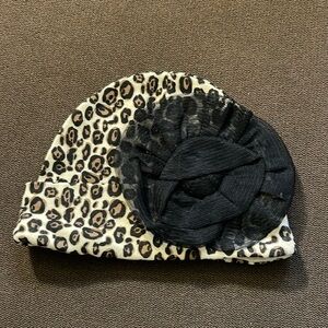 Free with any purchase. Baby hat, color black and brown. Like new.